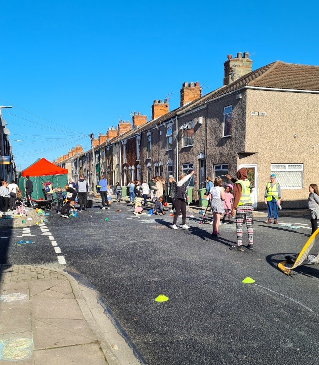 People cleaning the street