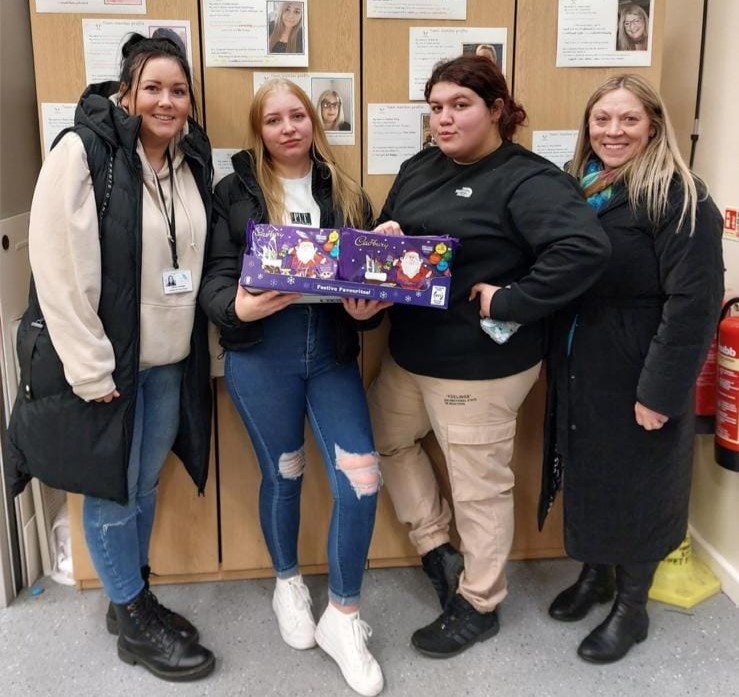 People holding selection boxes