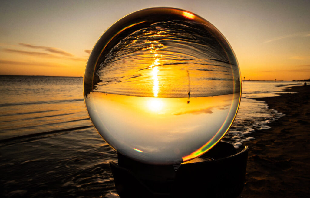 Artist shot of Cleethorpes beach through a glass orb