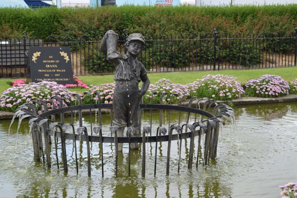 Leaking boot statue