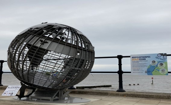 Globe shaped recycling bin