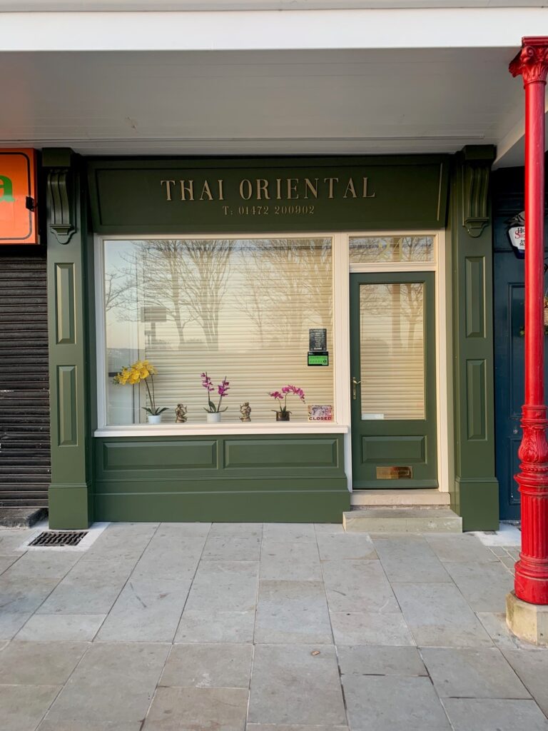 Shop front in green heritage colour