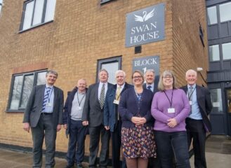 A group of Councillors and others stood outside Swan House