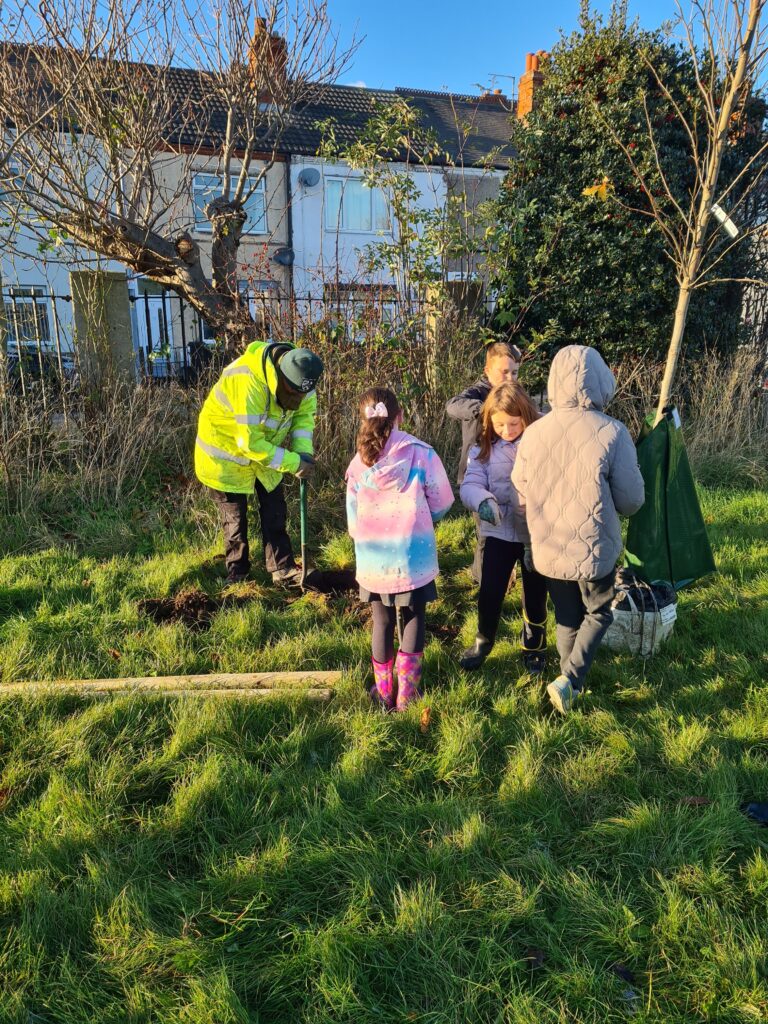 Volunteers and school children planting trees in West Marsh, Grimsby