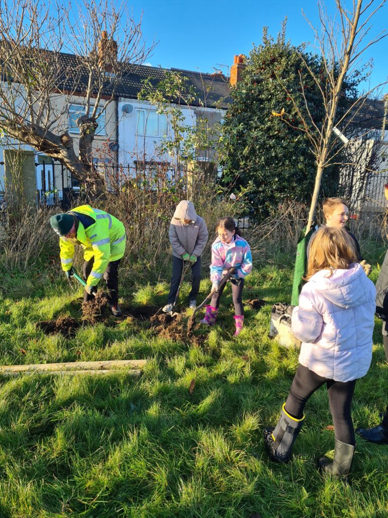 Volunteers and school children planting trees in West Marsh, Grimsby