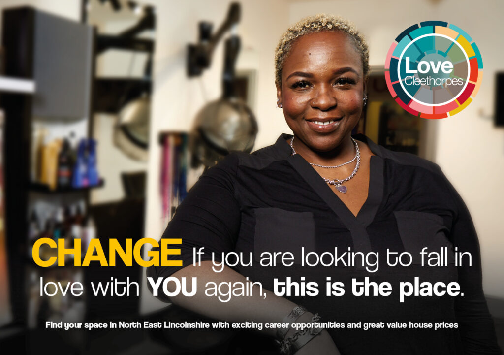 Postcard with a photo of a woman in a hair salon. Text reads: Change, if you are looking to fall in love with YOU again, this is the place. Find your space in North East Lincolnshire with exciting career opportunities and great value house prices.
