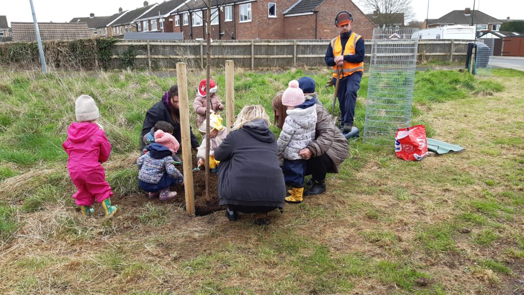 Volunteers and school children planting trees in Scartho