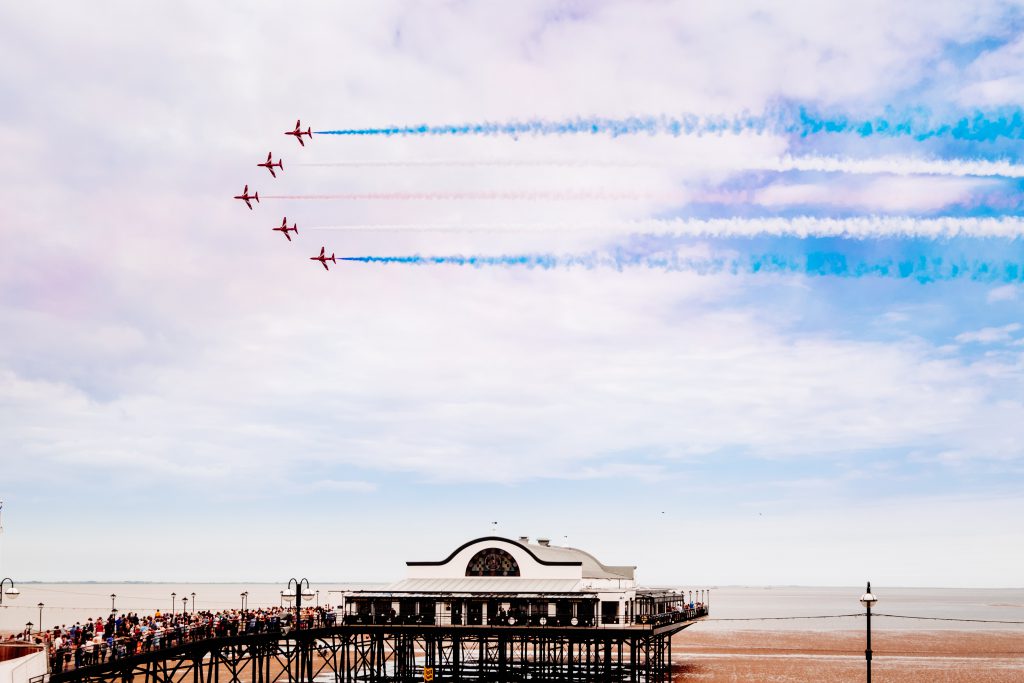 The Red Arrows flying over Cleethorpes Pier on Armed Forces Day.