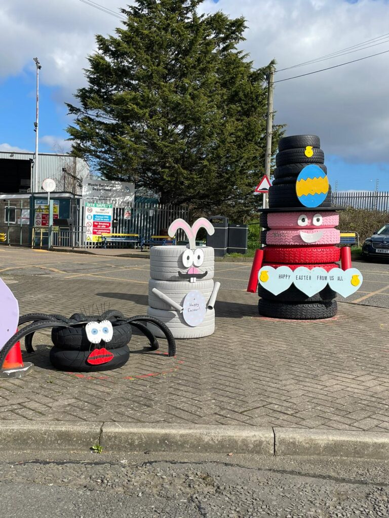 Display of Easter characters outside the the tip, made from old tires