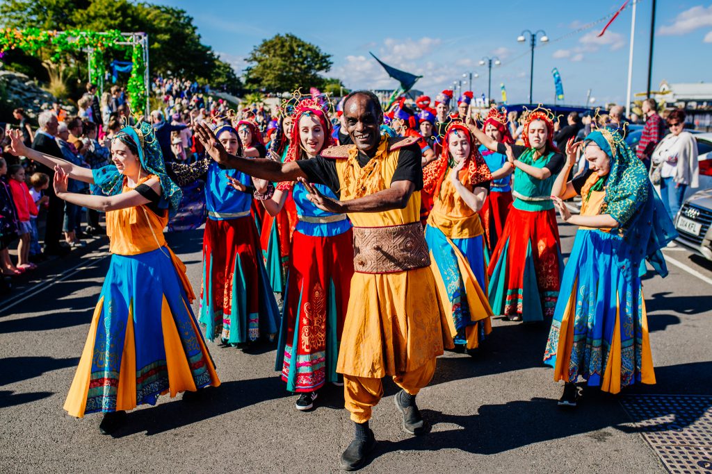 'Global Grooves - Manchester' dancers performing down the promenade at Cleethorpes' Festival of the Sky.