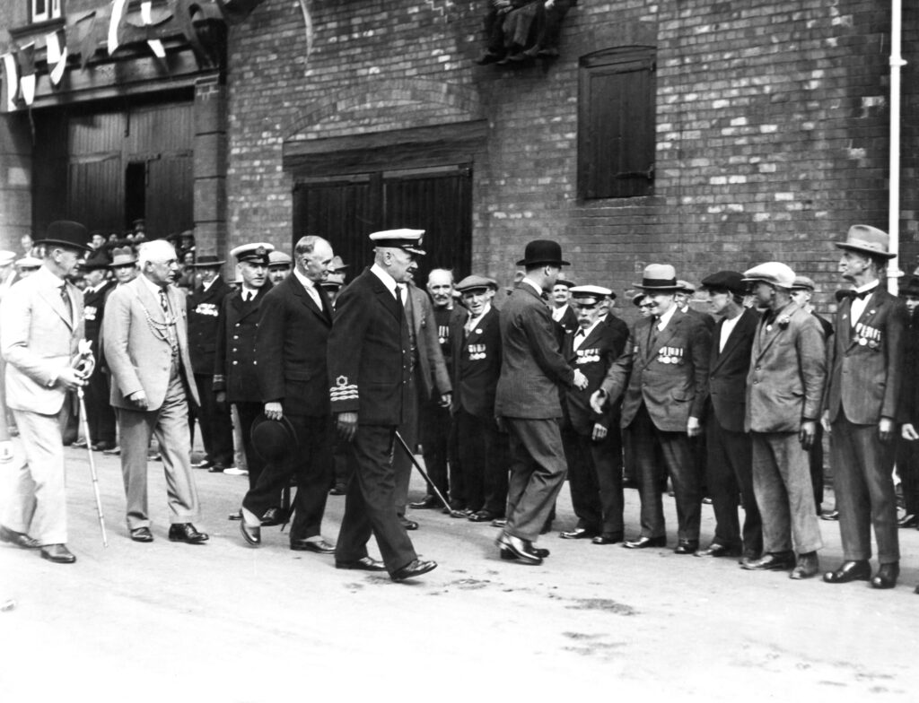 19th July 1928: Prince Edward, Prince of Wales inspecting the Guard of Honour of minesweepers and veterans of the First World War during the official opening ceremony of Corporation Bridge.