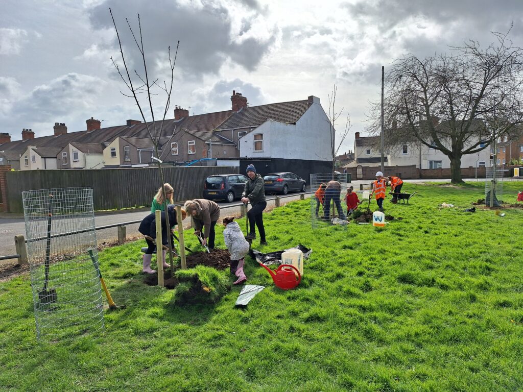 Children from Lisle Marsden School and community volunteers planting trees