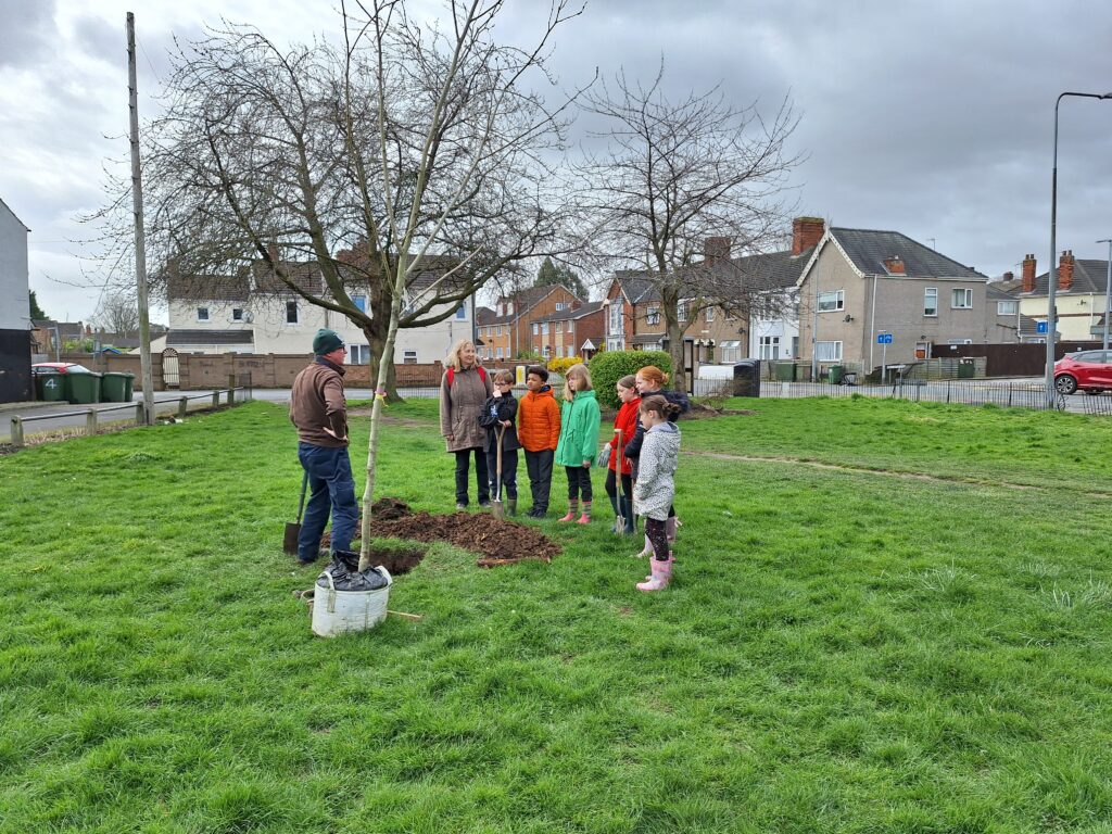 Children from Lisle Marsden School and community volunteers planting trees
