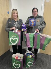 A photo of Morrisons supermarket staff with their chocolate Easter egg donation