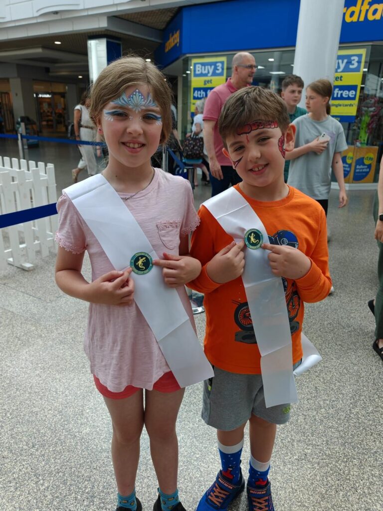 Two children with badges