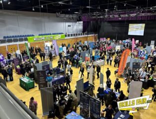 A busy auditorium with students in at a careers event