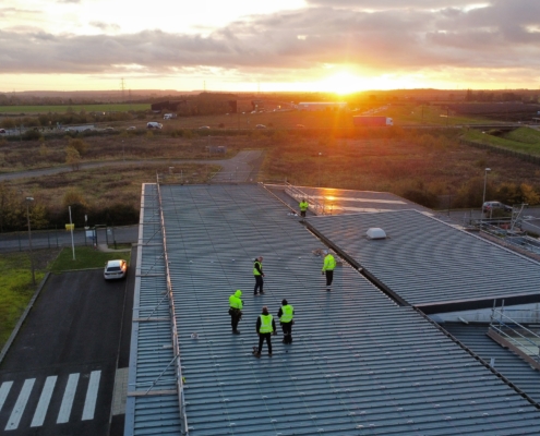People on the roof with solar panels