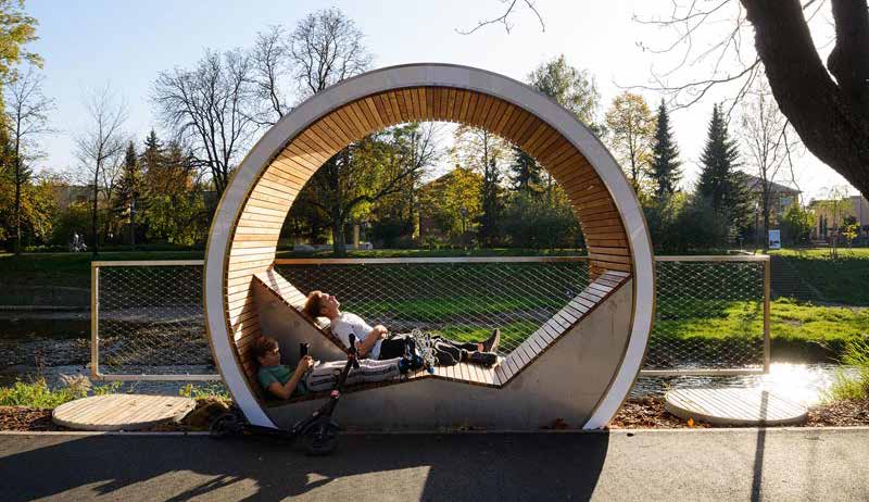 Circular bench with people laying inside