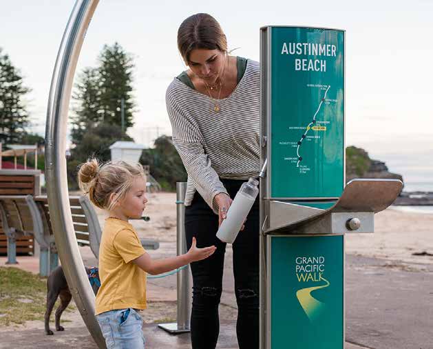 Woman and child at a water supply machine