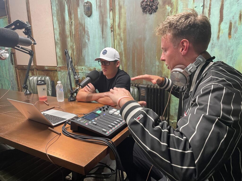 A photo of Jack directing Tommy as he records the voiceover for the advert.