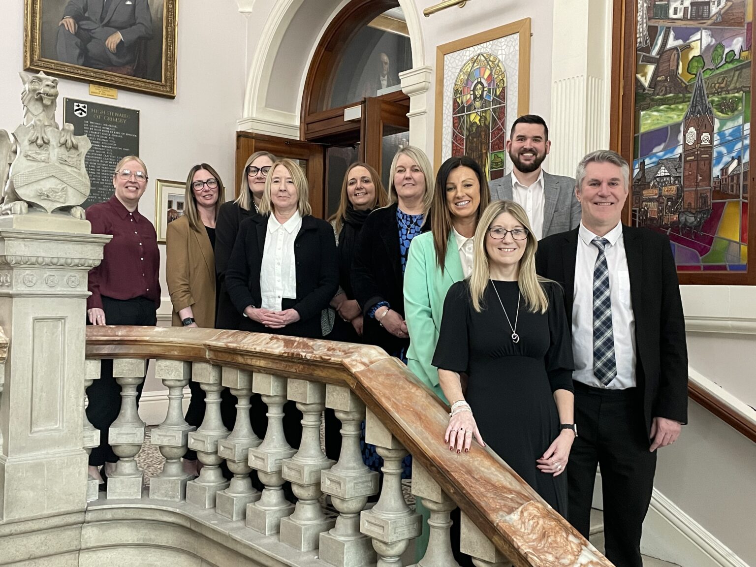 A photo of the Children's Leadership Team on the steps of Grimsby Town Hall.
