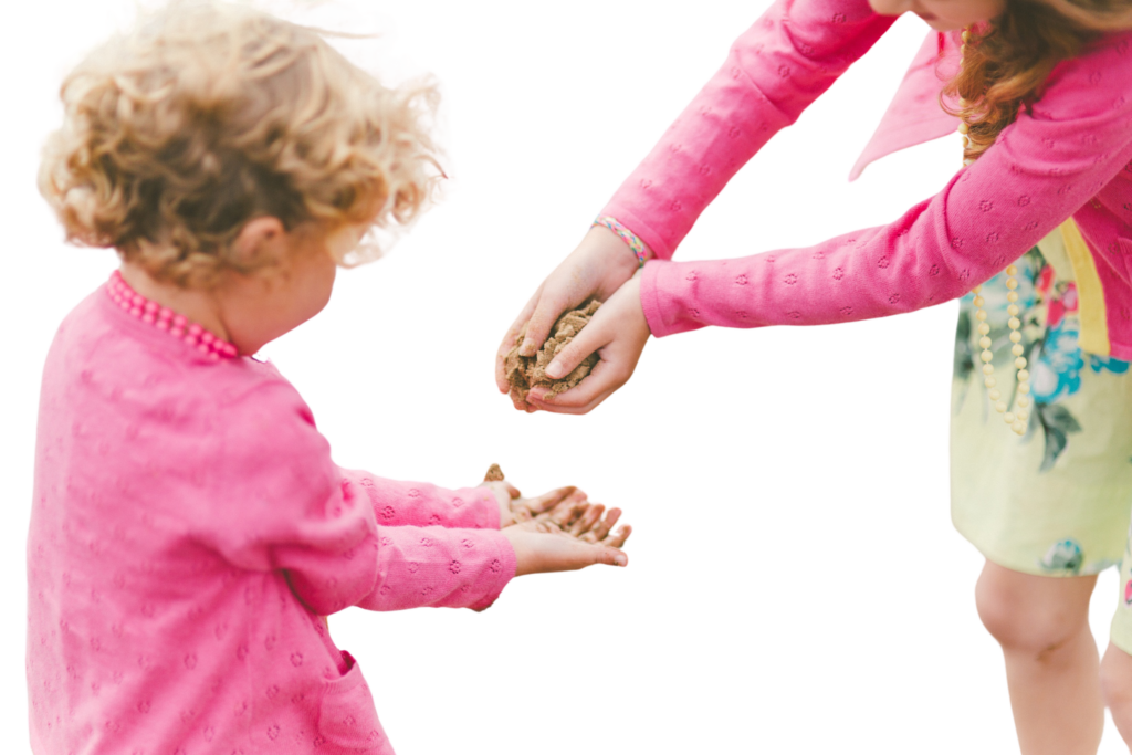 Two girls playing on the beach