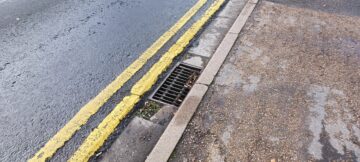 Broken road drain