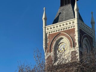 A photo of the clock tower, against a blue sky