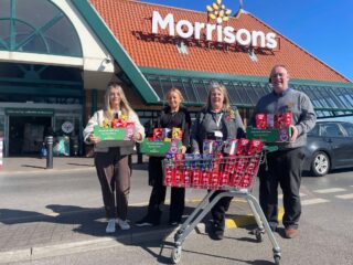 A photo of Council staff and Morrisons representatives outside the store.