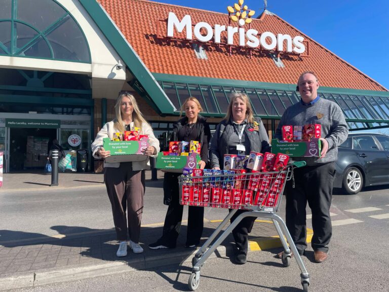 A photo of Council staff and Morrisons representatives outside the store.