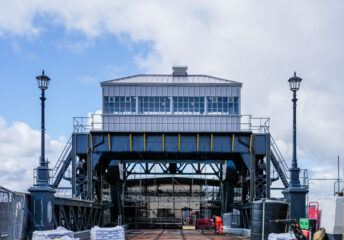 A photo of the control room of Corporation Road Bridge against a cloudy blue sky