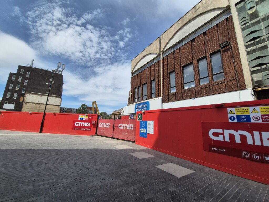 Former BHS building behind site hoardings