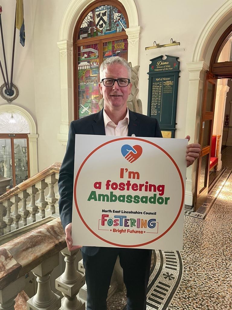 1. Rob Walsh, Former Chief Executive of North East Lincolnshire Council, pictured holding the Foster-friendly Ambassador kitemark.