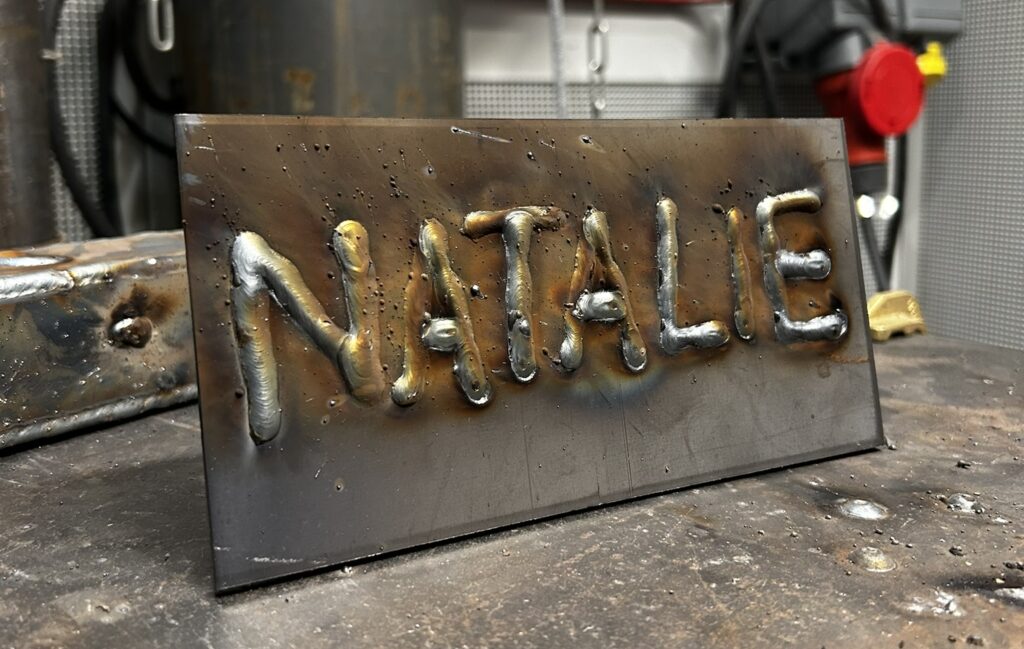'Natalie' welded into metal