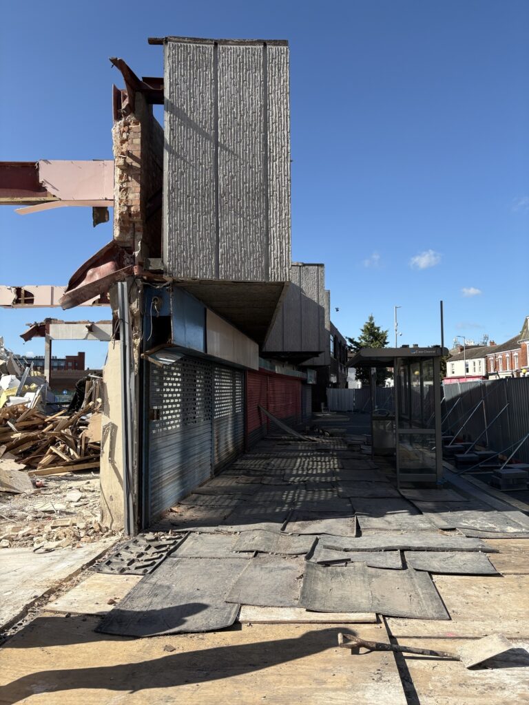Front of buildings being demolished