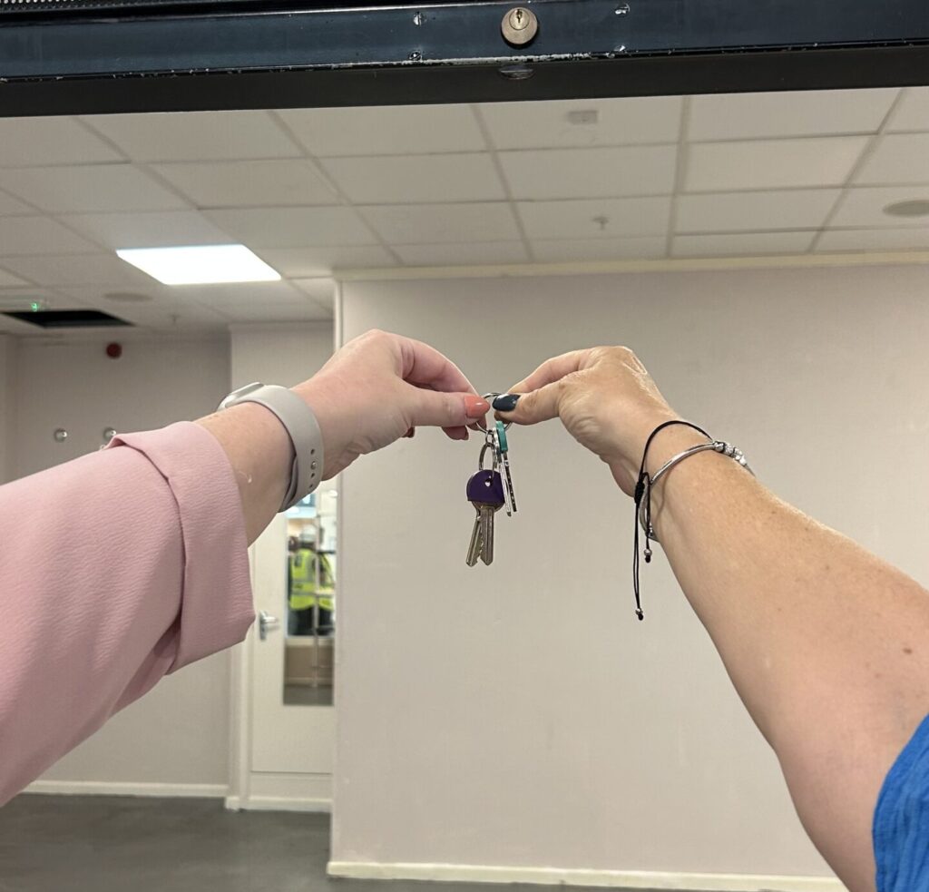 Hands holding keys