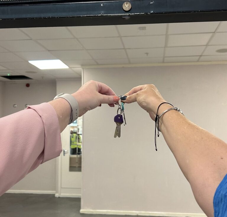 Hands holding keys