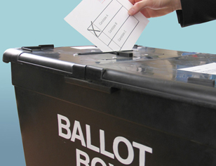 Person putting ballot into a box