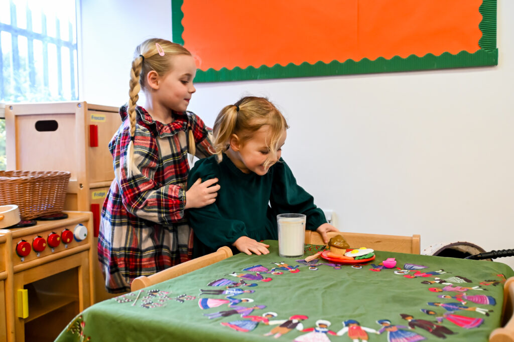 two children playing at a table
