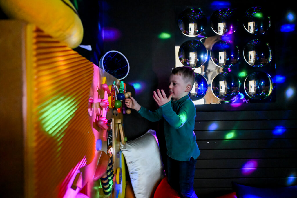 young boy in sensory room