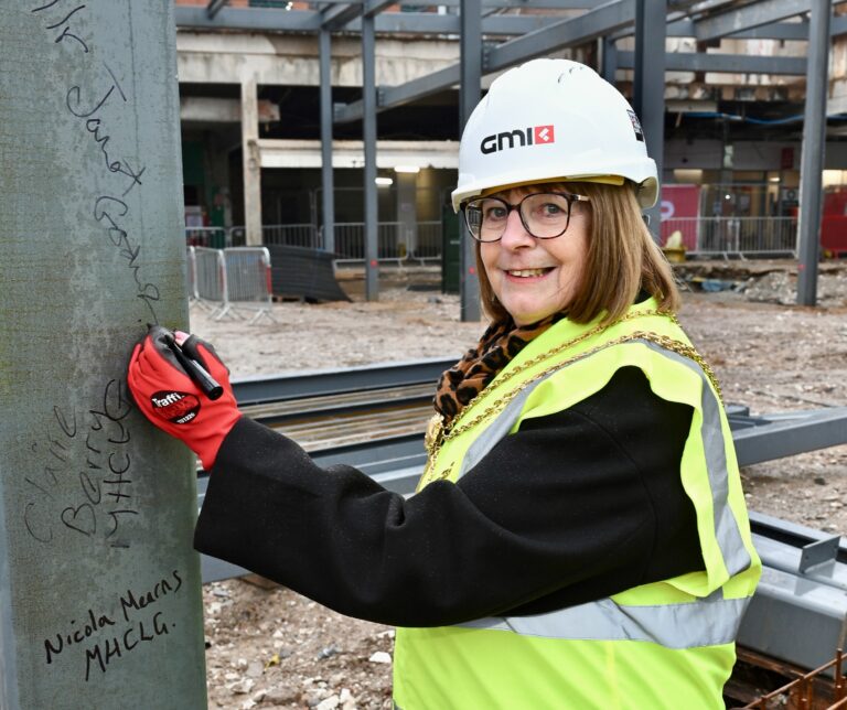 Mayor of North East Lincolnshire signing the steel at the Freshney Place development