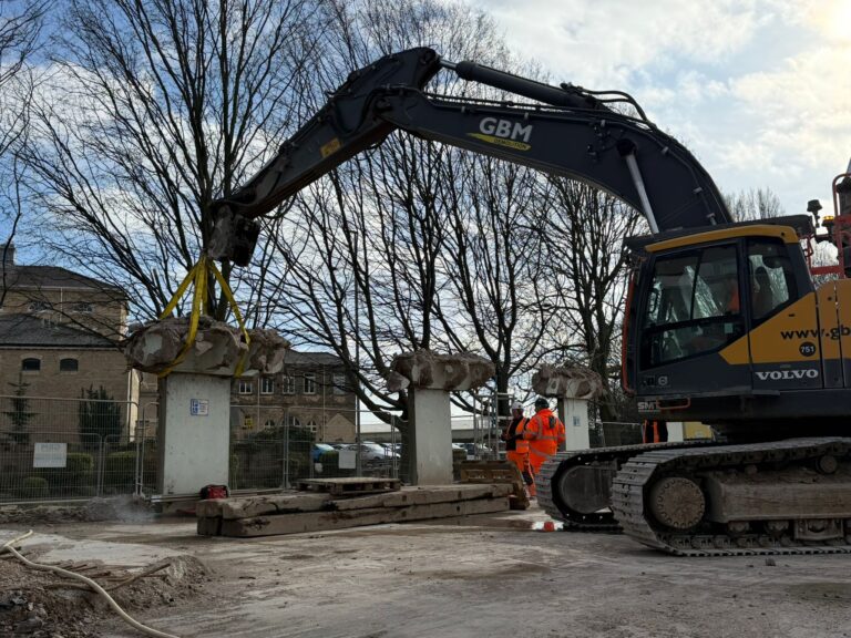 Artwork supported by slings