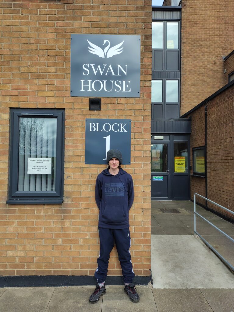 Nathan stands in front of the Swan House building.