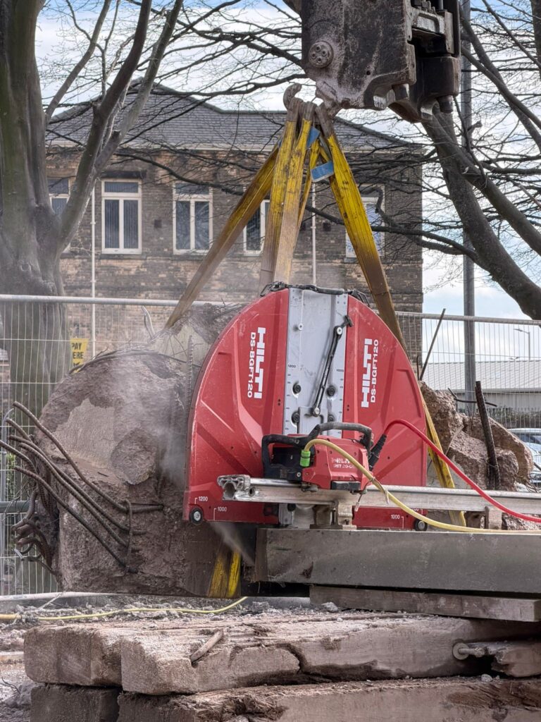 Specialist cutting equipment removing the excess concrete from Gosney panel