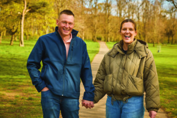 Beth and Colby - two local foster carers - post in a wooded location