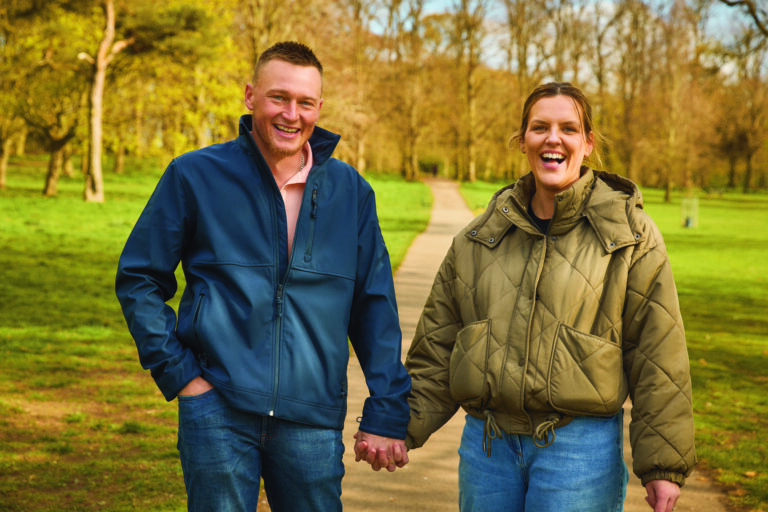Beth and Colby - two local foster carers - post in a wooded location
