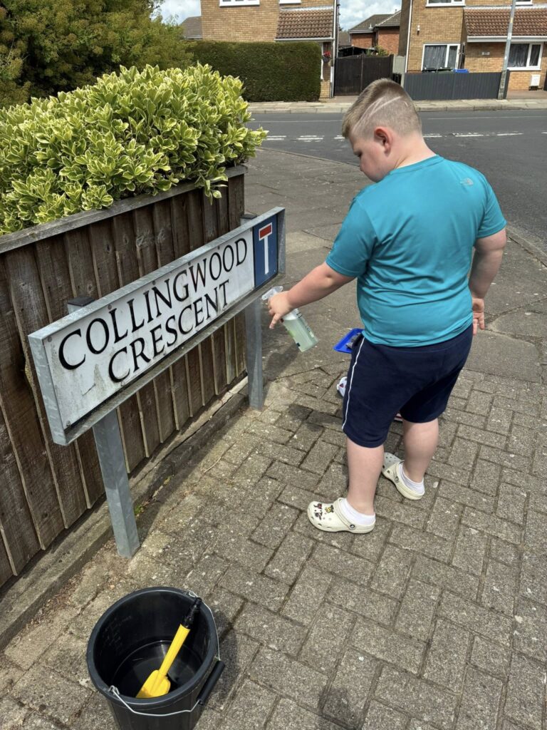 Young Grimsby boy keeping the streets clean one sign at a time