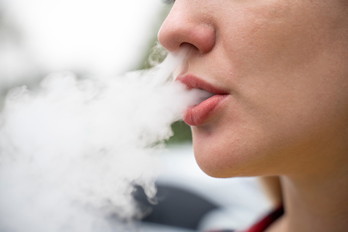 Somebody with smoke coming out their mouth