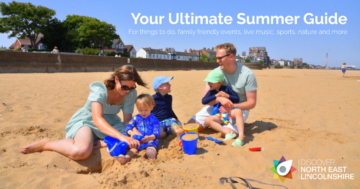 Family sitting on Cleethorpes beach