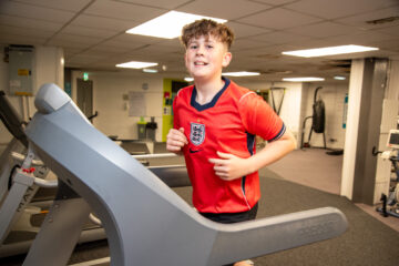 Boy running on a treadmill